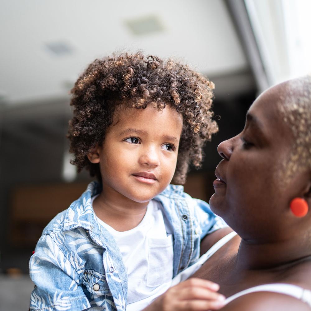 A woman holds a child